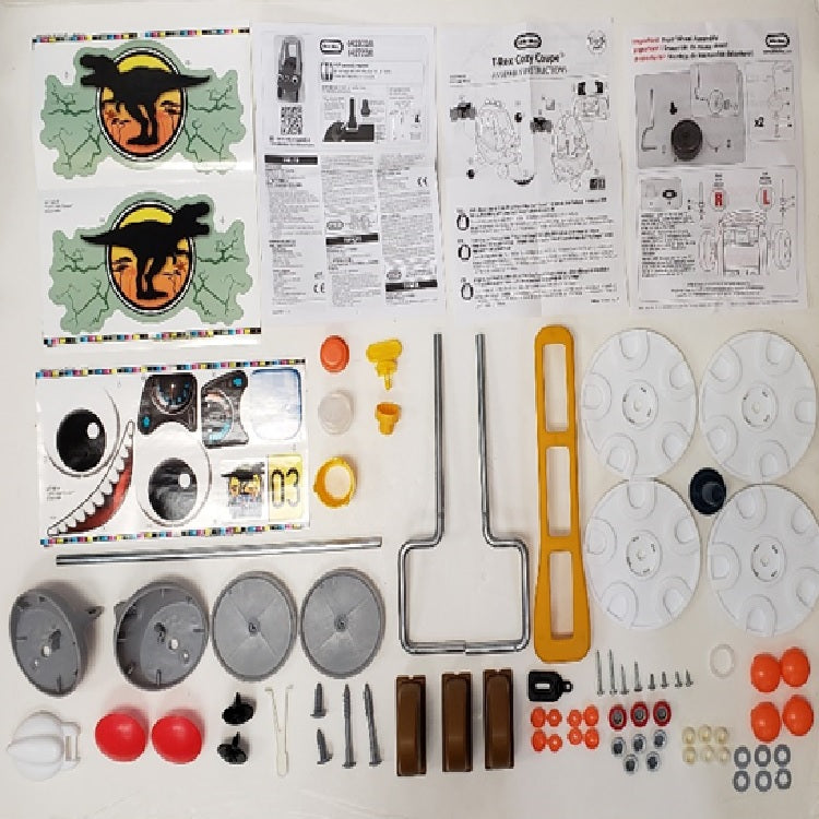 Hardware pack- Gas Cap. Screws. Bushing Wire Form. Washers. Steering Wheel O-Ring. Hubcaps. Top hat Tool. Wire form Left/Right. Retaining Clip. Fastener. Cap nut. Horn Button. Axle. Decals. Horn. Eye Fronts. Eye Backs Left & Right. Spike. Base Yellow